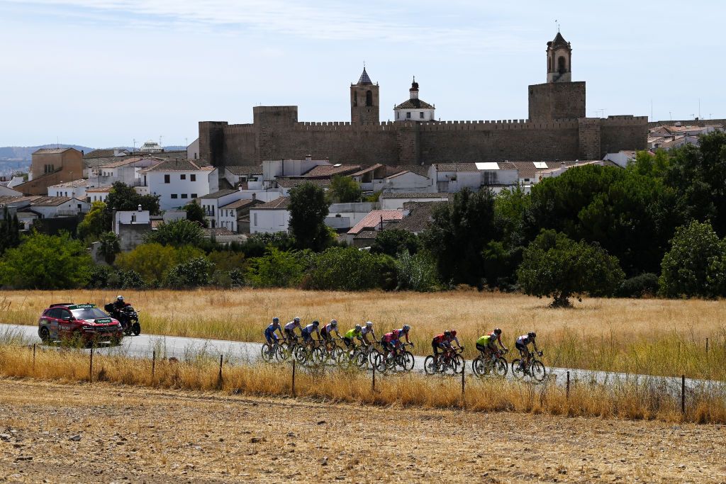 MONASTERIO DE TENTUDA SPAIN SEPTEMBER 07 Clment Champoussin of France and AG2R Citren Team Gino Mder of Switzerland and Team Bahrain Victorious Bob Jungels of Luxembourg and AG2R Citren Team Fred Wright of United Kingdom and Team Bahrain Victorious Jess Herrada Lopez of Spain and Team Cofidis Rigoberto Uran Uran of Colombia and Team EF Education Easypost Quentin Pacher of France and Team Groupama FDJ Alessandro De Marchi of Italy and Team Israel Premier Tech Lawson Craddock of United States and Team BikeExchange Jayco Kenny Elissonde of France and Team Trek Segafredo Elie Gesbert of France and Team Arka Samsic Marc Soler Gimenez of Spain and UAE Team Emirates and Simon Guglielmi of France and Team Arka Samsic compete in the breakaway passing close to Fregenal de la Sierra Village during the 77th Tour of Spain 2022 Stage 17 a 1624km stage from Aracena to Monasterio de Tentuda 1095m LaVuelta22 WorldTour on September 07 2022 in Monasterio de Tentuda Spain Photo by Justin SetterfieldGetty Images