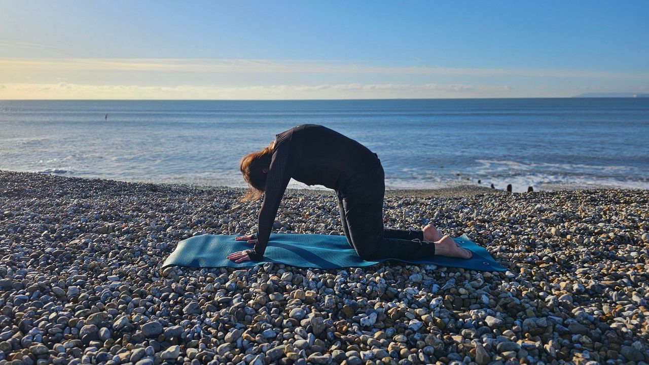 Jennifer performing cat cow pose