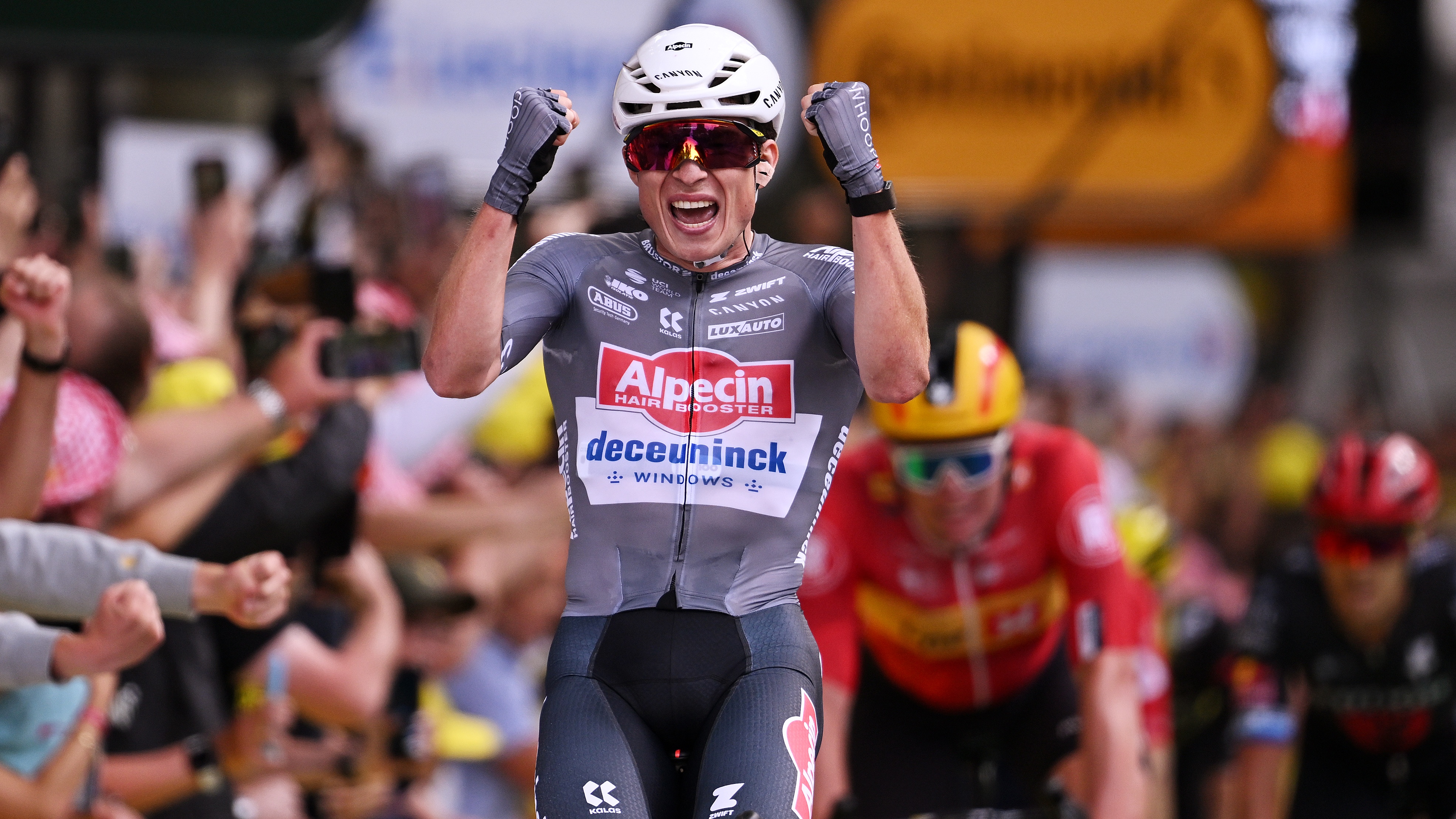 Jasper Philipsen celebrates his win at stage 1 of the Tour de France.