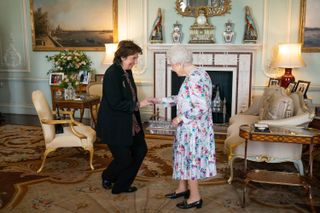 Dame Imogen Cooper is received by Queen Elizabeth II prior to being presented with The Queen's Medal for Music for 2019