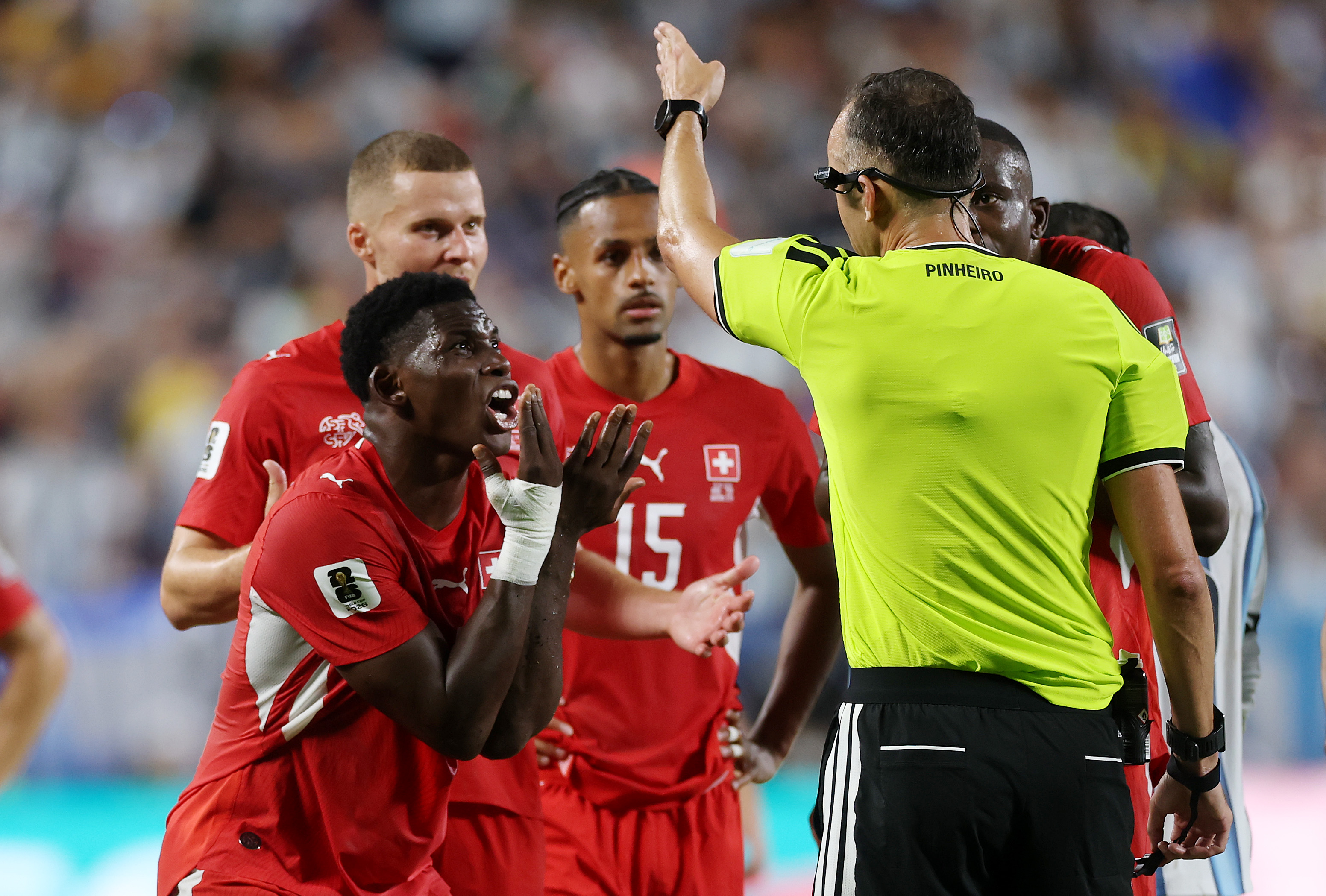 KANSAS CITY, MISSOURI - JULY 11: Breel Embolo #7 of Switzerland argues with referee Joao Pinheiro following his second yellow card and subsequent red card during the FIFA World Cup 2026 Quarter Final match between Argentina and Switzerland at Kansas City Stadium on July 11, 2026 in Kansas City, Missouri. (Photo by Lars Baron/Getty Images)