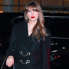 Taylor Swift arrives at Nobu Downtown in a blazer dress and thigh high boots with chanel earrings