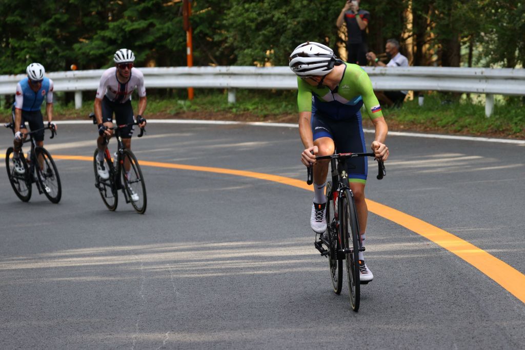 Tadej Pogacar R of Team Slovenia attack in the breakaway in the mens cycling road race during the Tokyo 2020 Olympic Games at the Fuji International Speedway in Oyama Japan on July 24 2021 Photo by Tim de Waele POOL AFP Photo by TIM DE WAELEPOOLAFP via Getty Images