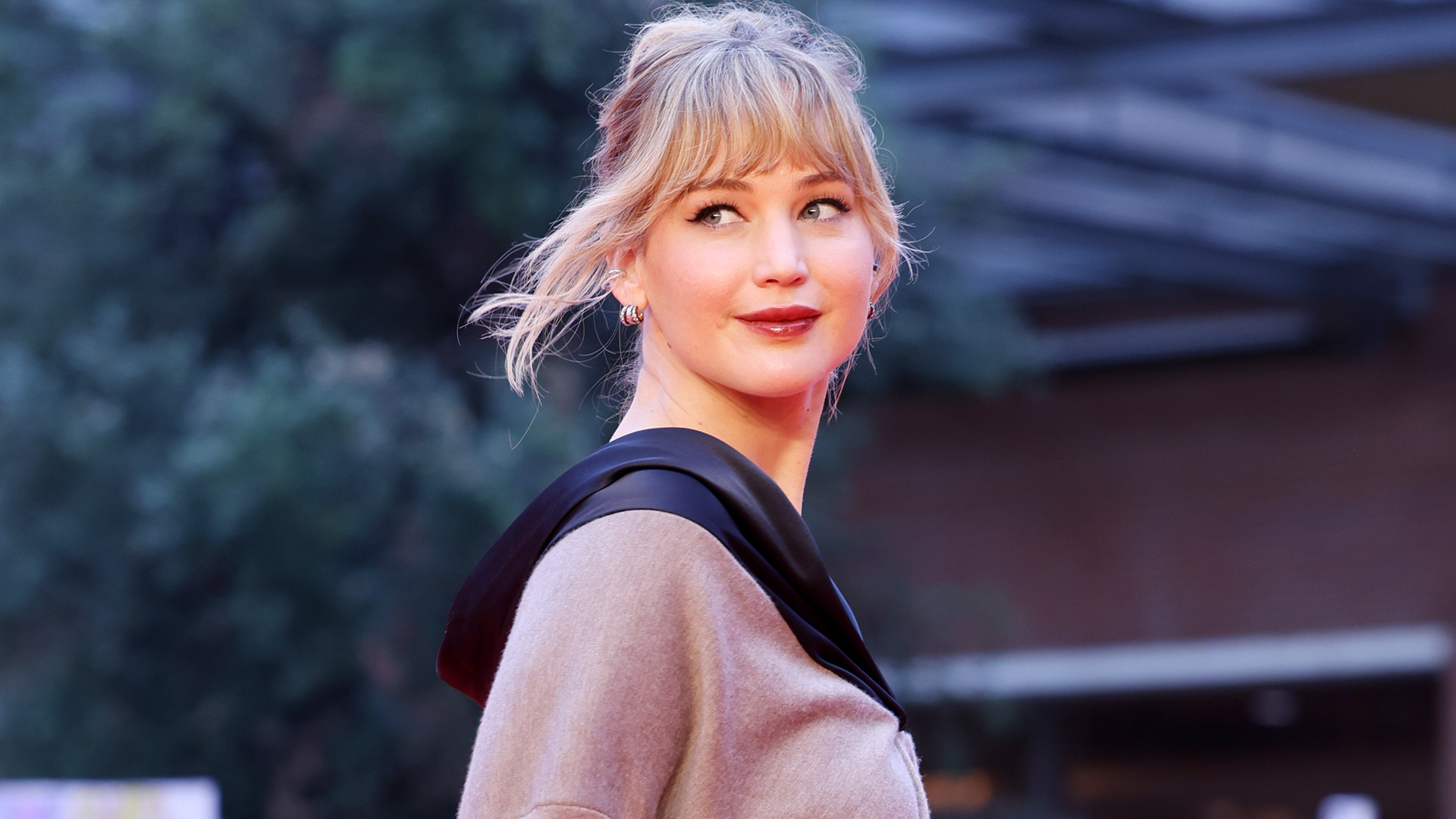 Jennifer Lawrence attempted to keep a low profile in a winter coat, a scarf, and her favorite Haflinger clogs