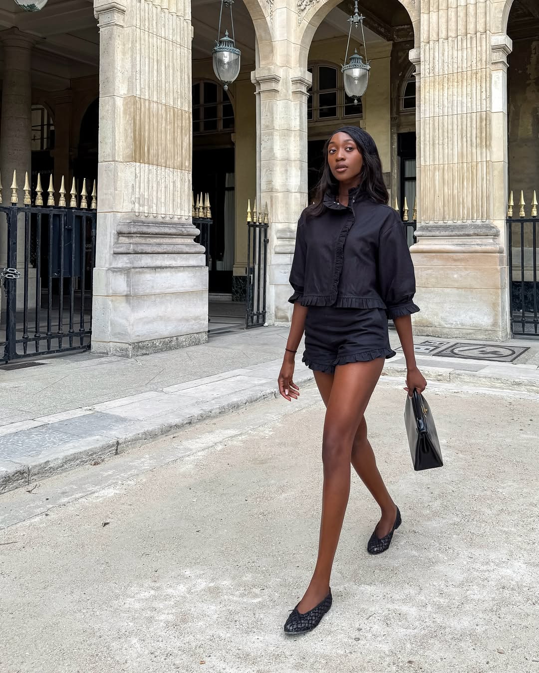 Emmanuelle Koffi wearing ballet flats with shorts in Paris