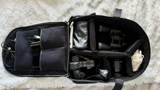 black camera bag containing photography equipment