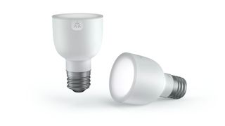 Two Matter-enabled light bulbs on a white background.