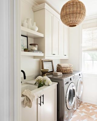 White laundry room with rattan lamp