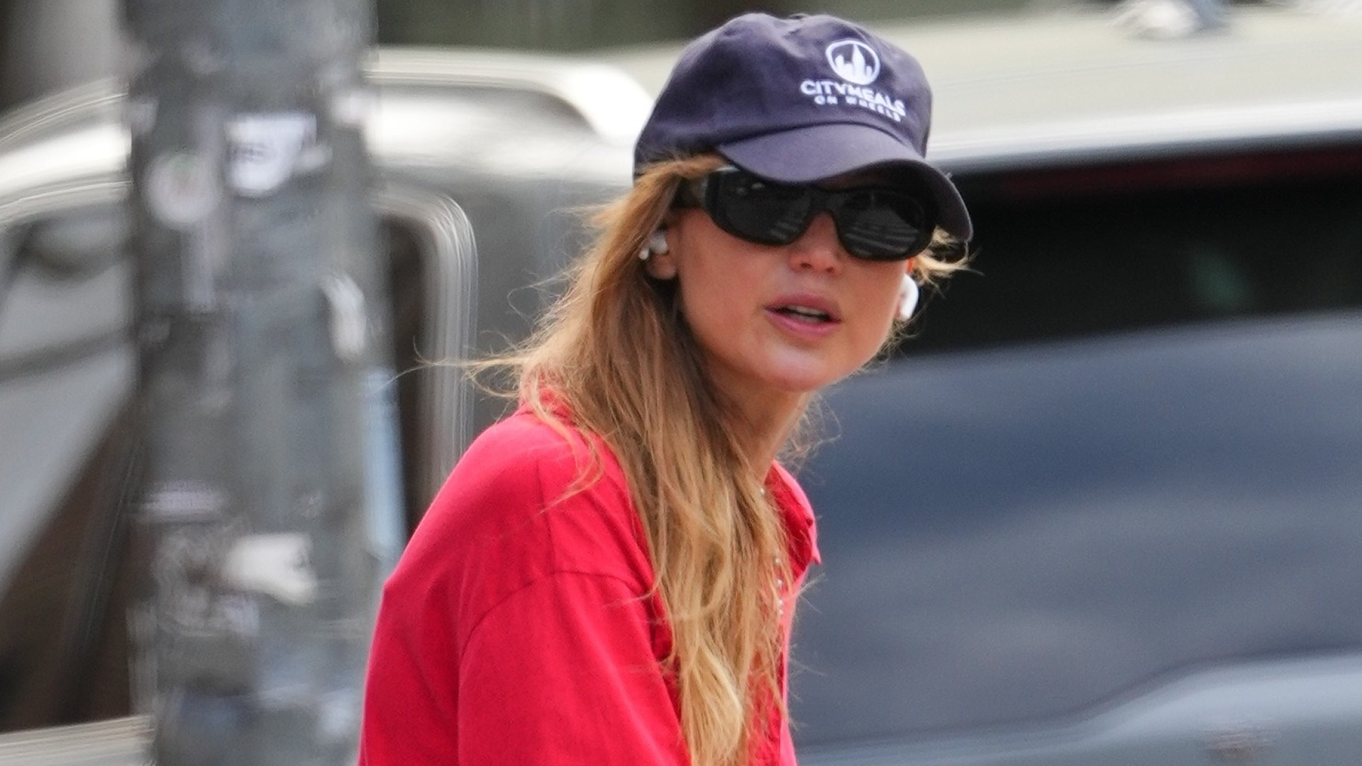 Jennifer Lawrence styled her strawberry red polo top with peony pink pants, making spring's ultimate color combination