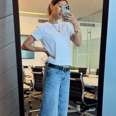 Woman in a white tee and jeans