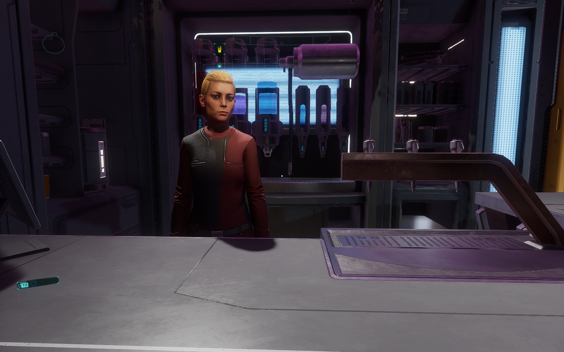 A woman standing behind a sci-fi bar.