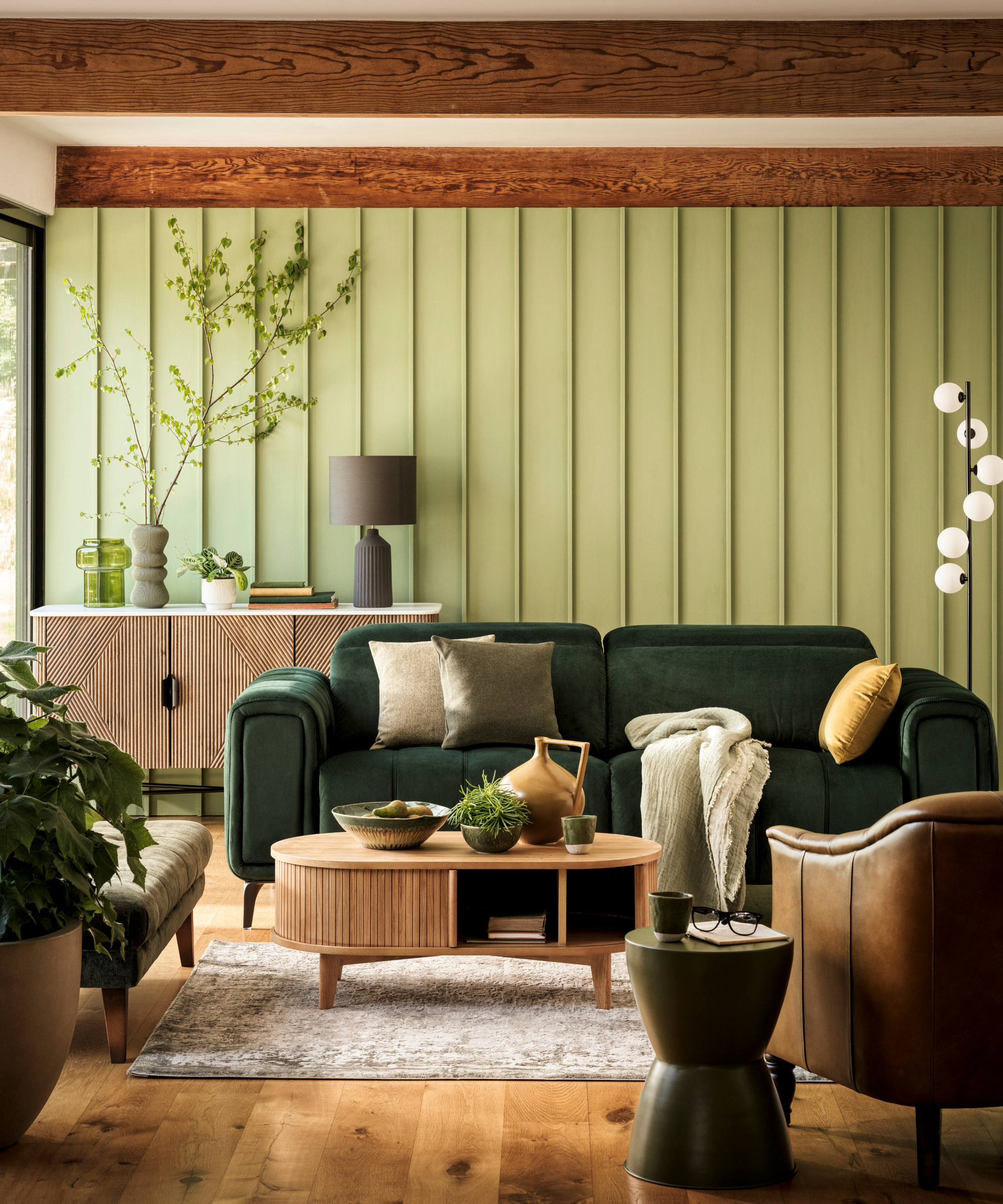 Green living room with wood panelling