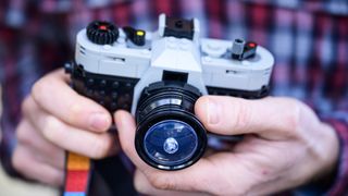 Lego Retro camera complete build in the hand, rotating the lens