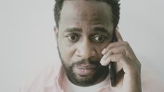 Worried man talking on the phone