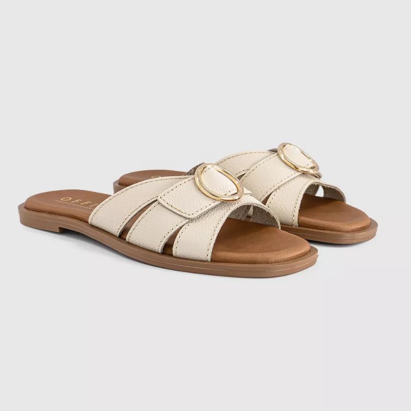 white sandals with gold buckle