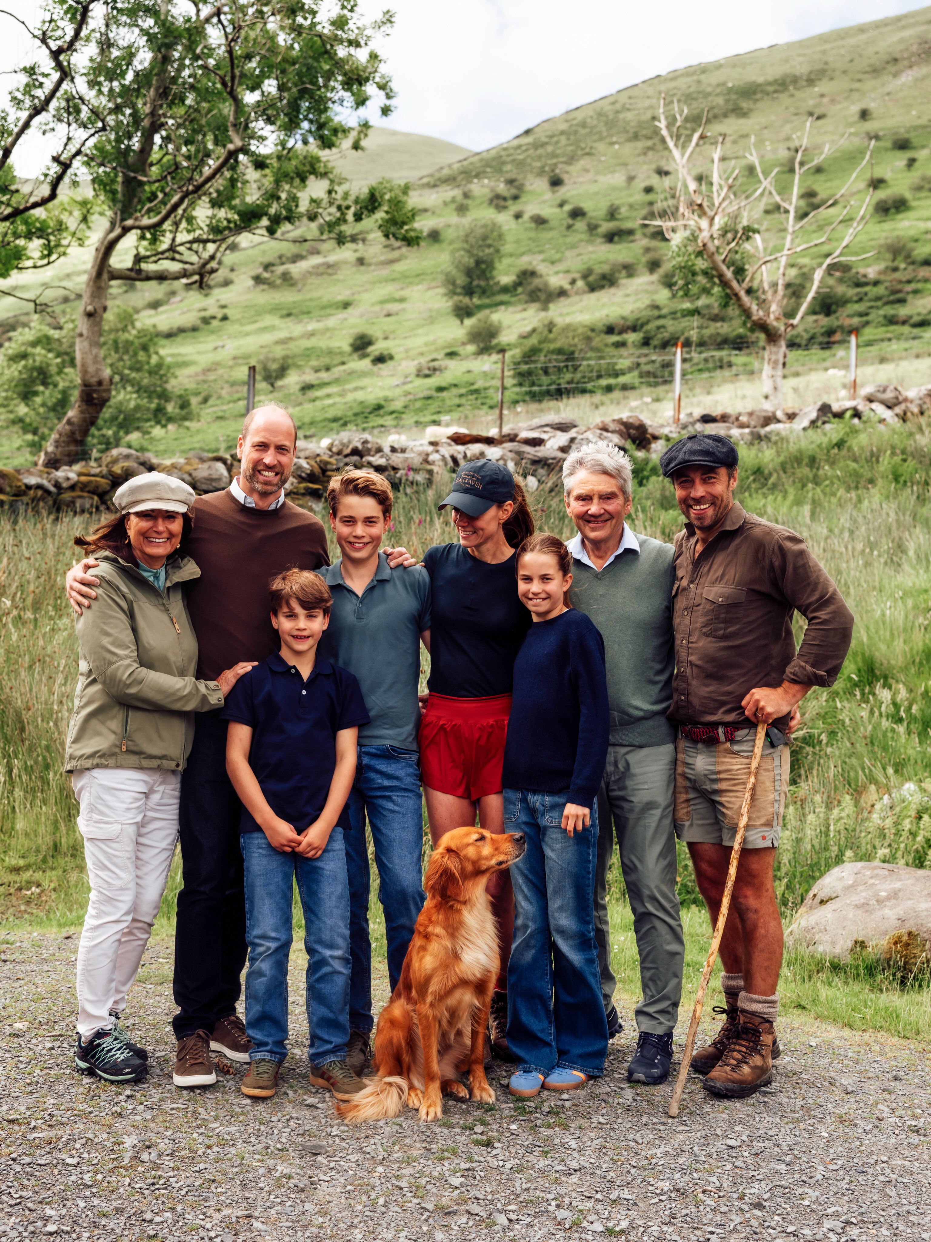 Princess Kate, wore is wearing red shorts and navy baseball cap, is greeted by her three children, Princess Charlotte, Prince George, and Prince Louis, who all wear matching denim jeans