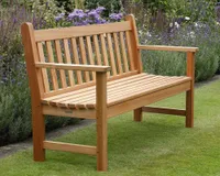 A wooden garden bench on a lawn