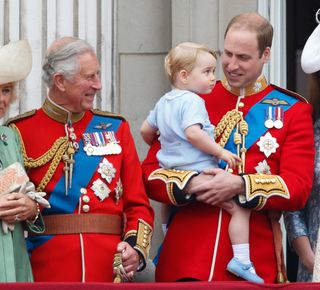 Prince Charles, Prince of Wales, Prince William, Duke of Cambridge and Prince George of Cambridge stand on the balcony of Buckingham Palace during Trooping the Colour