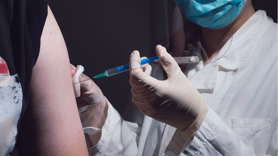 person getting vaccine