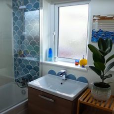 moroccan style bathroom with blue fish scale tiles and basin