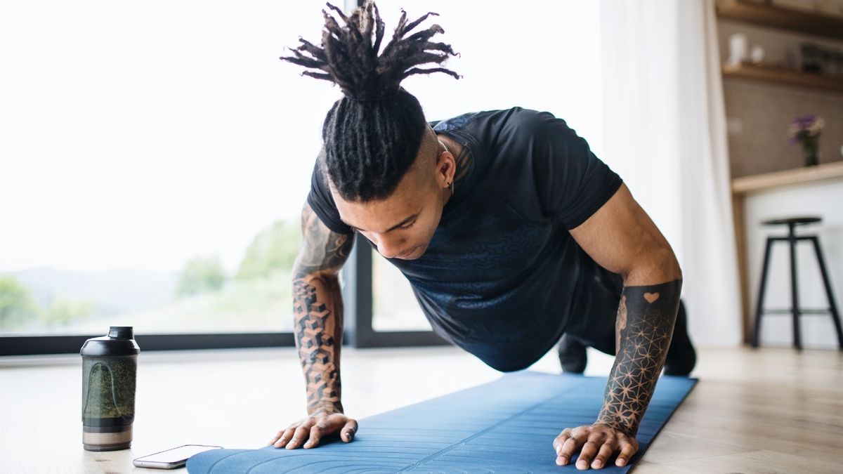 Man performs press-ups at home