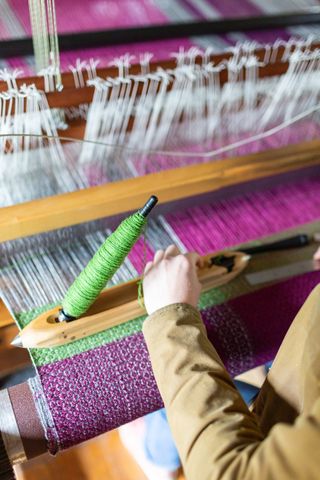 handmade in Britain weaving throws on a wooden loom