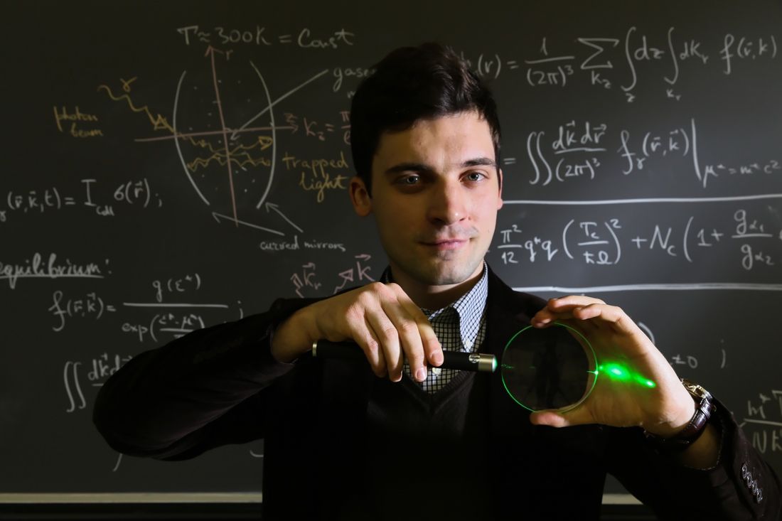 Alex Kruchkov, of the Swiss Federal Institute of Technology, demonstrates how light can be trapped inside a system, for example in a glass lens.