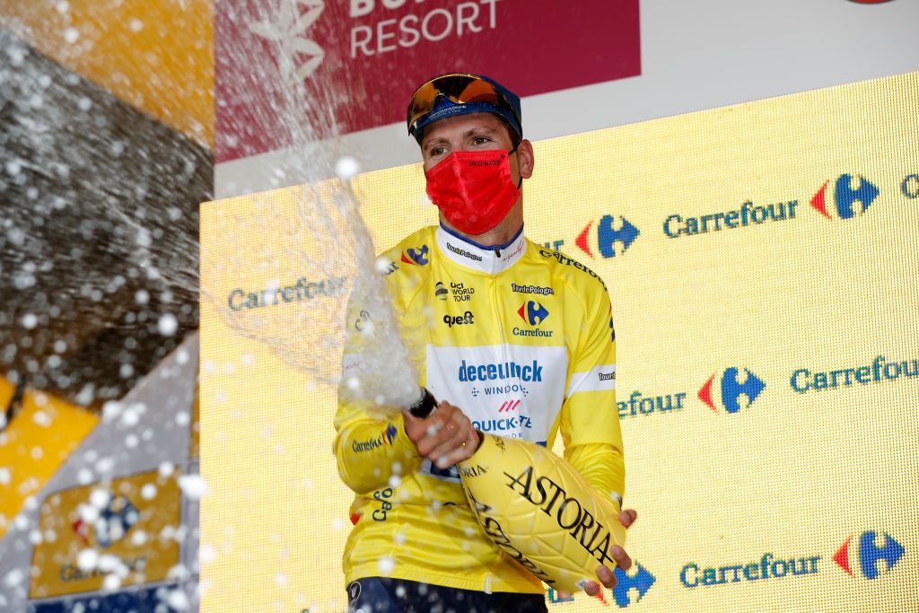 BUKOVINA RESORT POLAND AUGUST 12 Joo Pedro Gonalves Almeida of Portugal and Team Deceuninck QuickStep Yellow Leader Jersey celebrates at Podium during the 78th Tour de Pologne 2021 Stage 4 a 160km stage from Azoty Group Tarnw to Bukovina Resort 924m TourdePologne TDP2021 UCIWT on August 12 2021 in Bukovina Resort Poland Photo by Bas CzerwinskiGetty Images