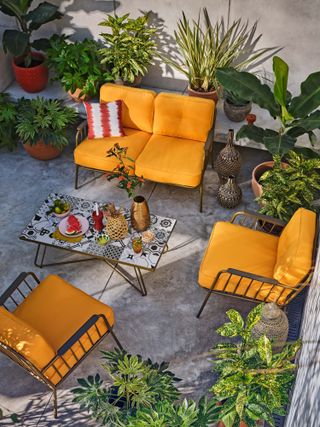 colourful outdoor furniture ideas: yellow chairs on patio