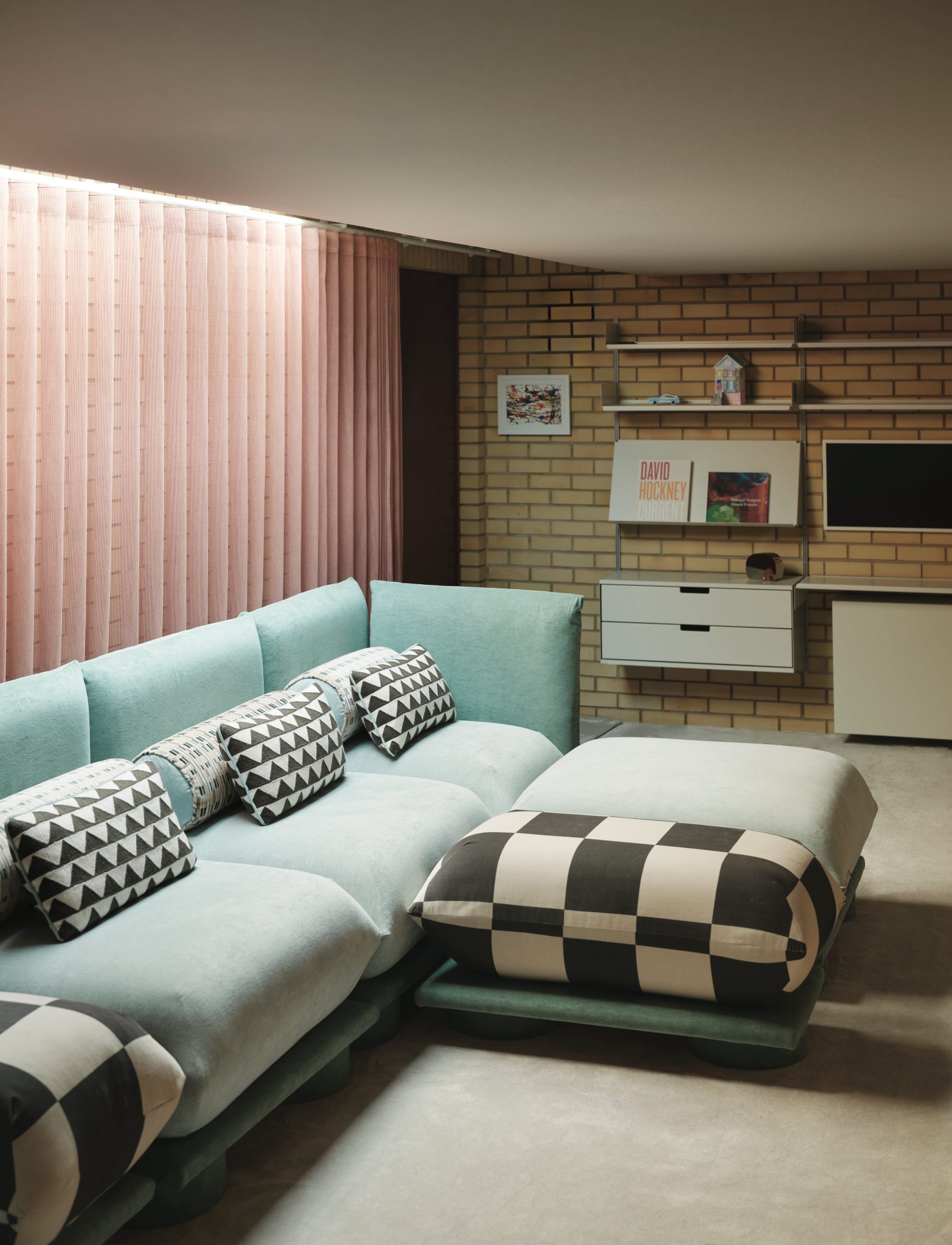pink curtain blue sofa living room cinema brick wall