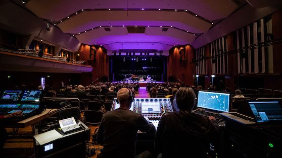 The Aalener Jazzfest stage alit in purple as audio engineers manage the sound with d&amp;b Soundscape.