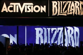 Giant screens displaying Activision and Blizzard logos at E3 2013.