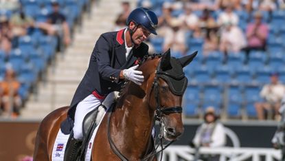 Carl Hester riding Fame at World Championships and patting him on the neck