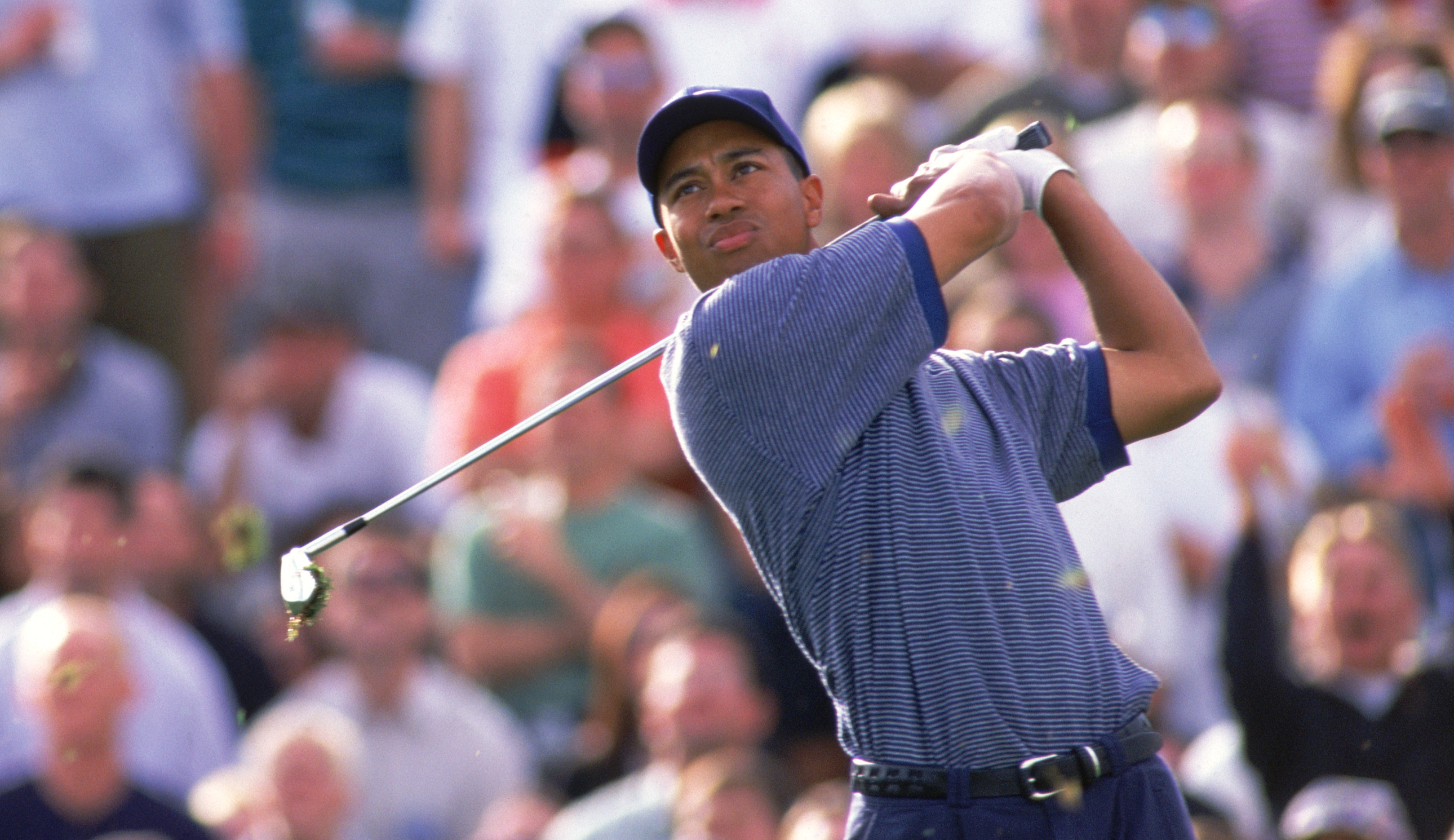 Tiger Woods hits an iron shot