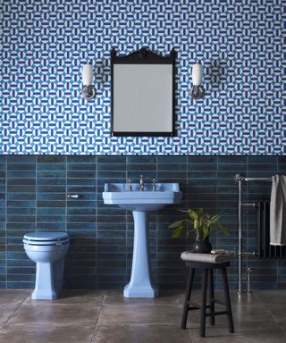 Blue bathroom with a colorful bathroom suite