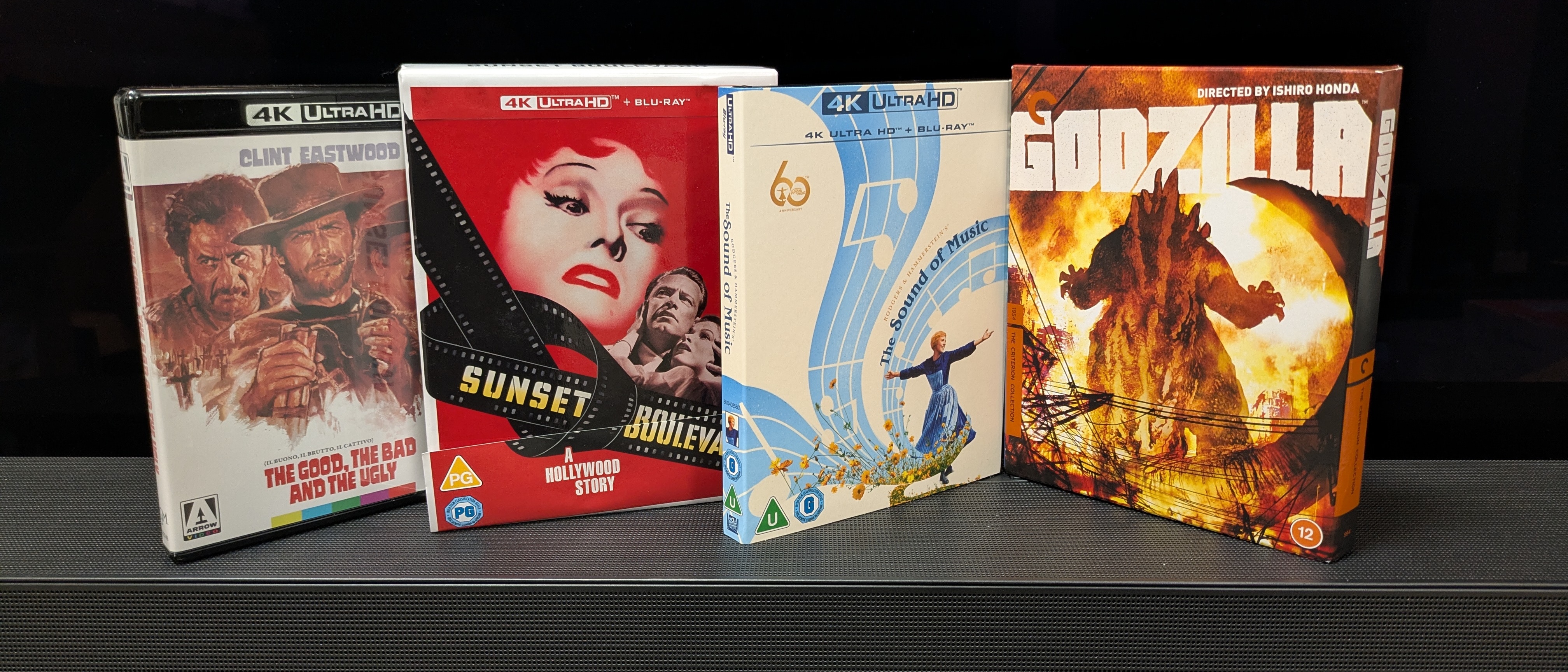 Photo of 4 4K Blu-rays cases, Sunset Boulevard, Godzilla, The Sound of Music, The Good, The Bad and The Ugly, in front of TV