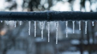 Icicles hanging off a pipe