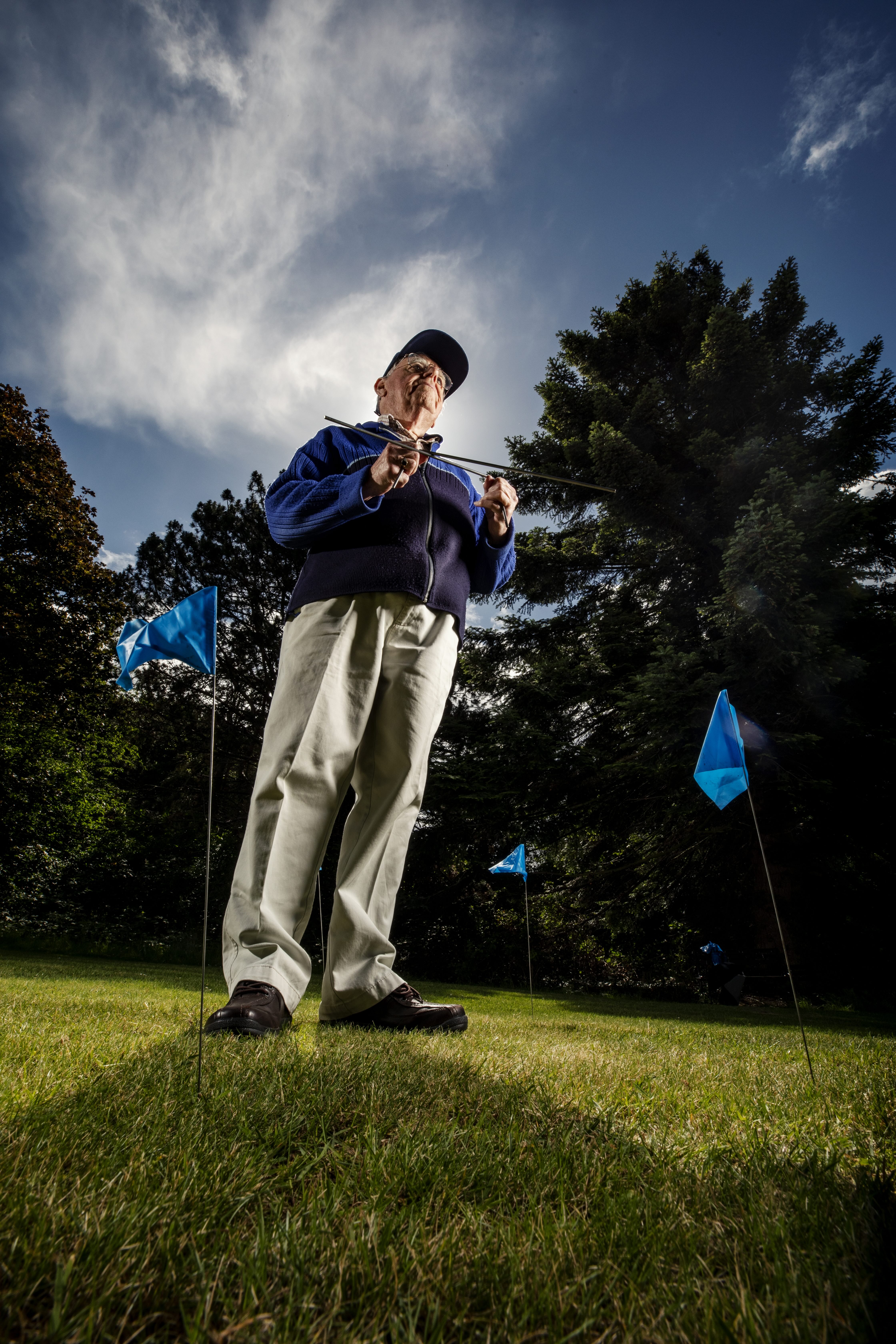 John Baker, Dowser/Water Diviner. When he finds a spot he makes exact location marks with his blue flags.