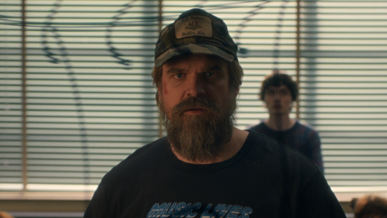 Hopper staring into camera in diner in Stranger Things Season 5