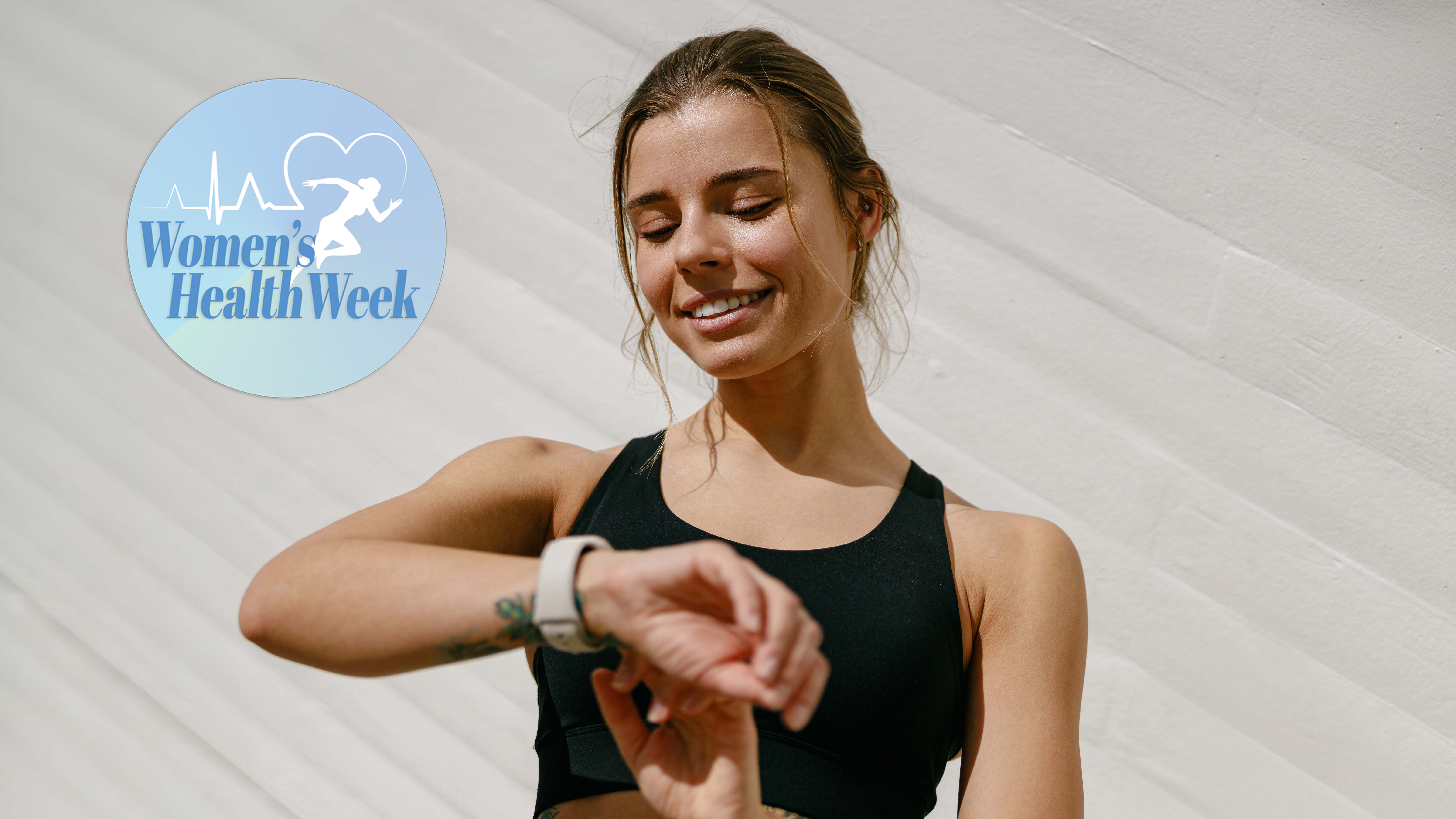 Woman smiling down at her fitness tracker with Women's Health Week badge top left