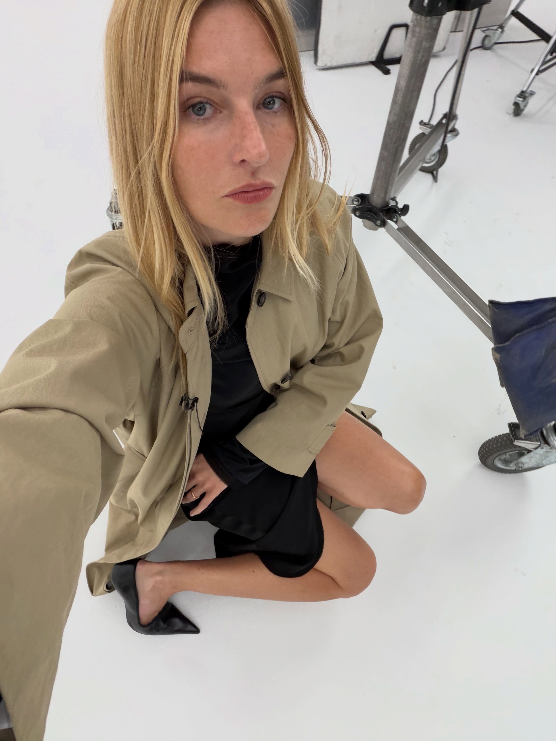 Camille Charri&amp;egrave;re wearing a trench coat.