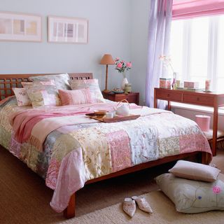 bedroom with blue wall and curtains on window