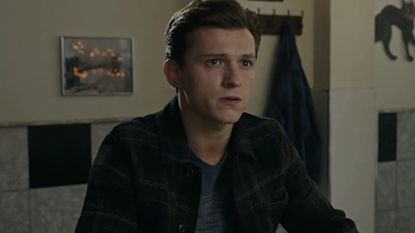Tom Holland as Peter Parker sitting in his during during Spider-Man: No Way Home