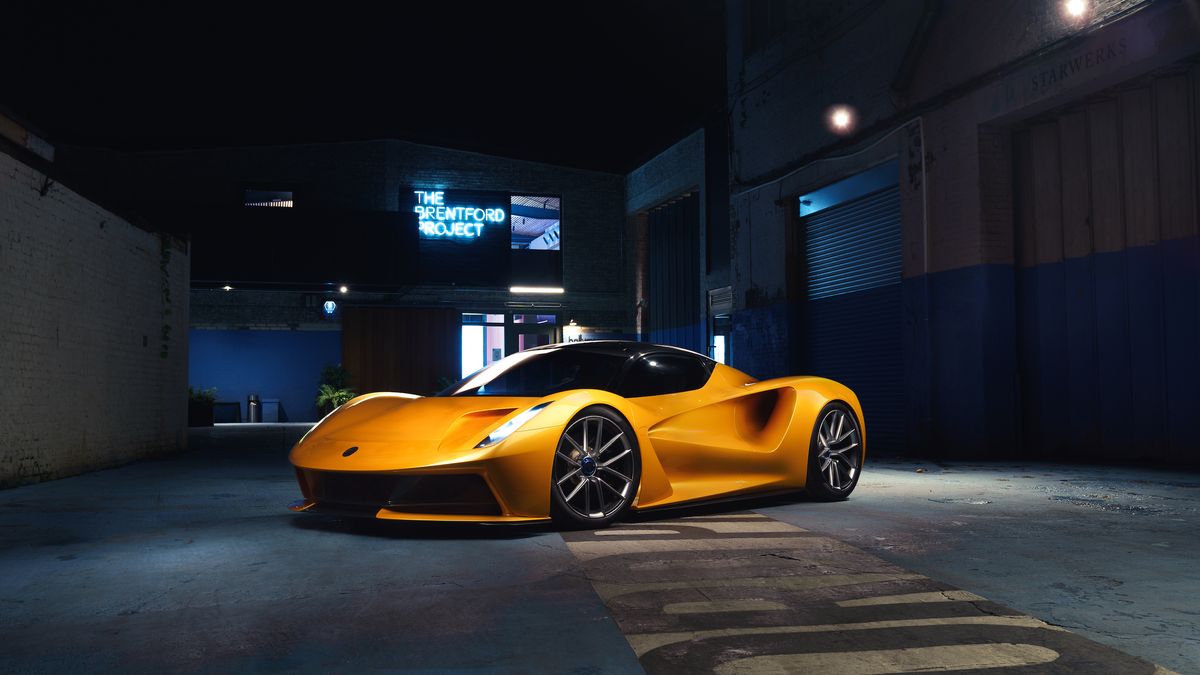 Yellow Lotus Evija parked in a warehouse