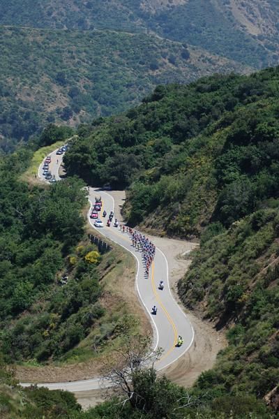 The peloton swarms toward the break.