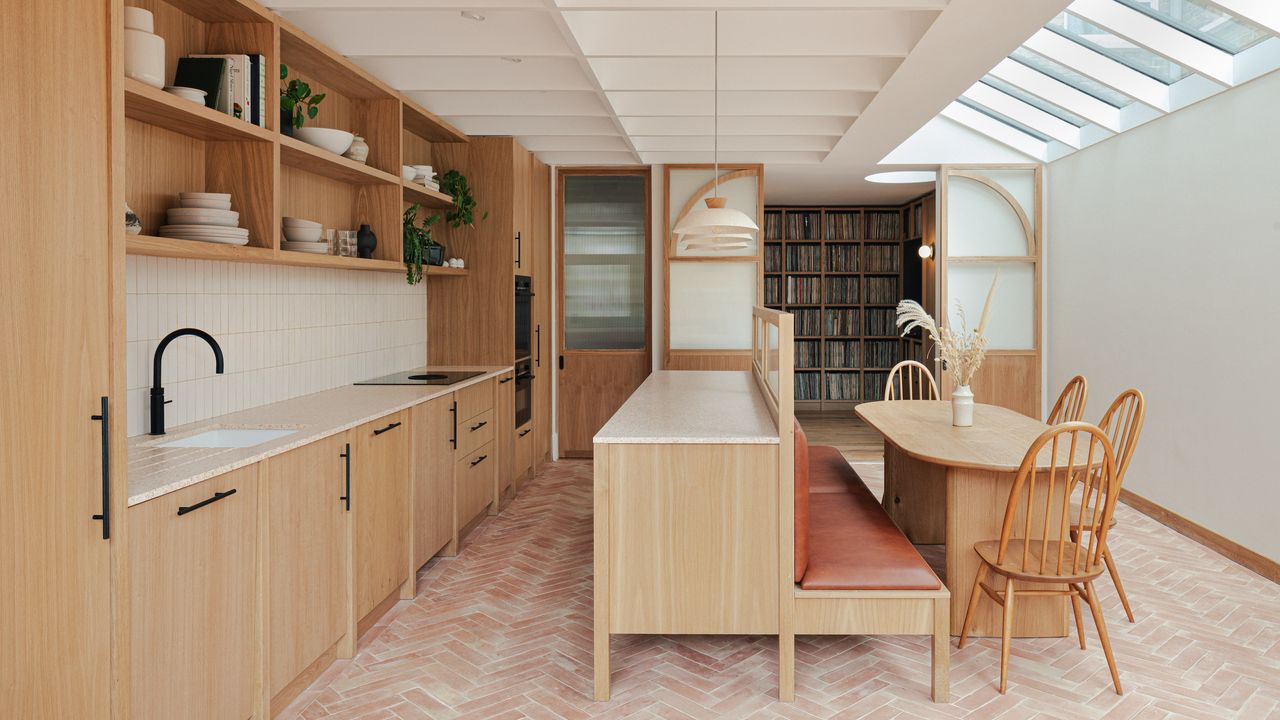 small kitchen extension in light oak and terracotta floors