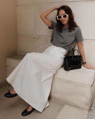 @deborabrosa wearing grey t-shirt and white maxi skirt