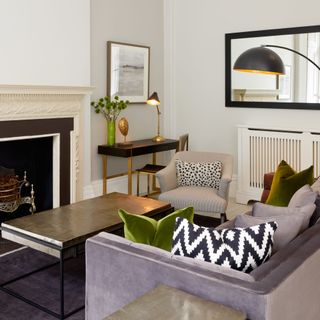 Living room with grey sofa, coffee table and fireplace