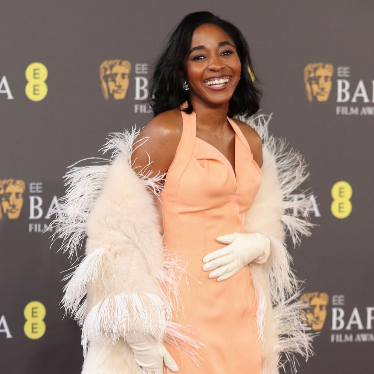 An image of Ayo Edebiri wearing Bottega Veneta at the 2024 BAFTAs, one of the best red carpet fashion moments of all time. 