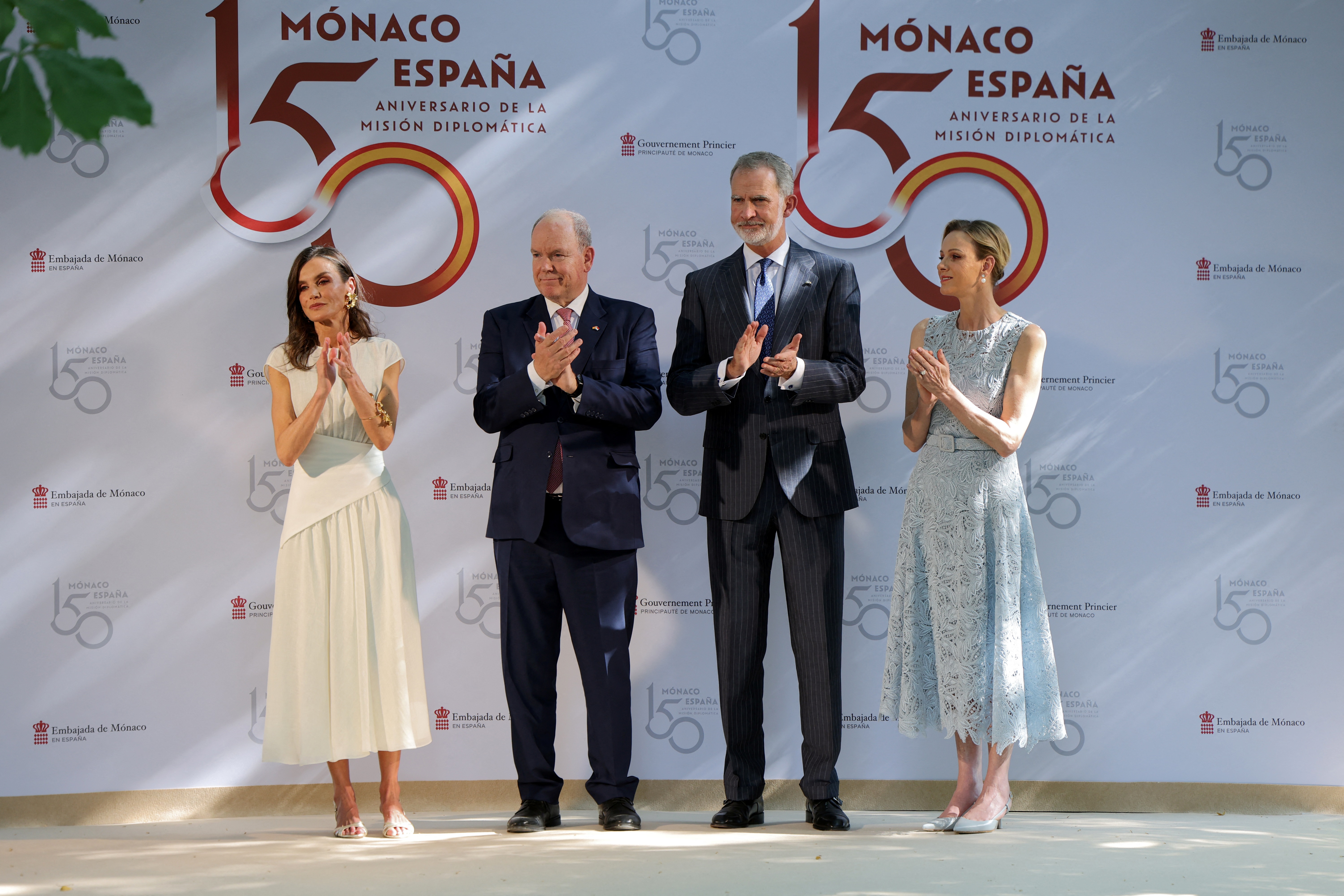 Queen Letizia, Prince Albert, King Felipe and Princess Charlene clapping on stage